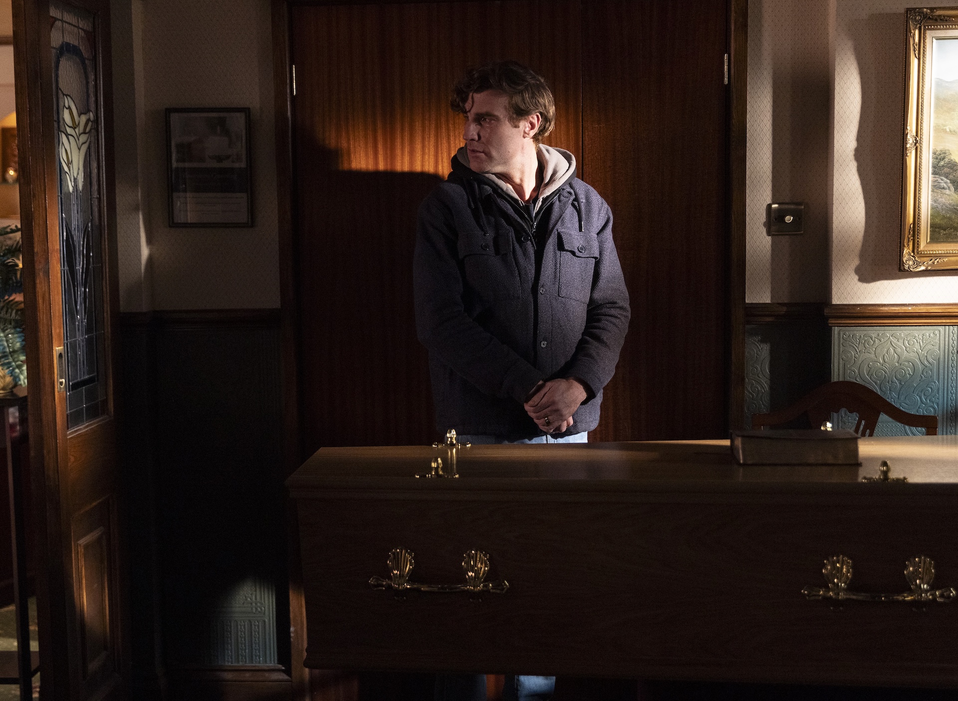 Theo upset at Billy's coffin in Coronation Street