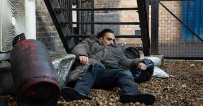 Ravi lying in rubbish in EastEnders