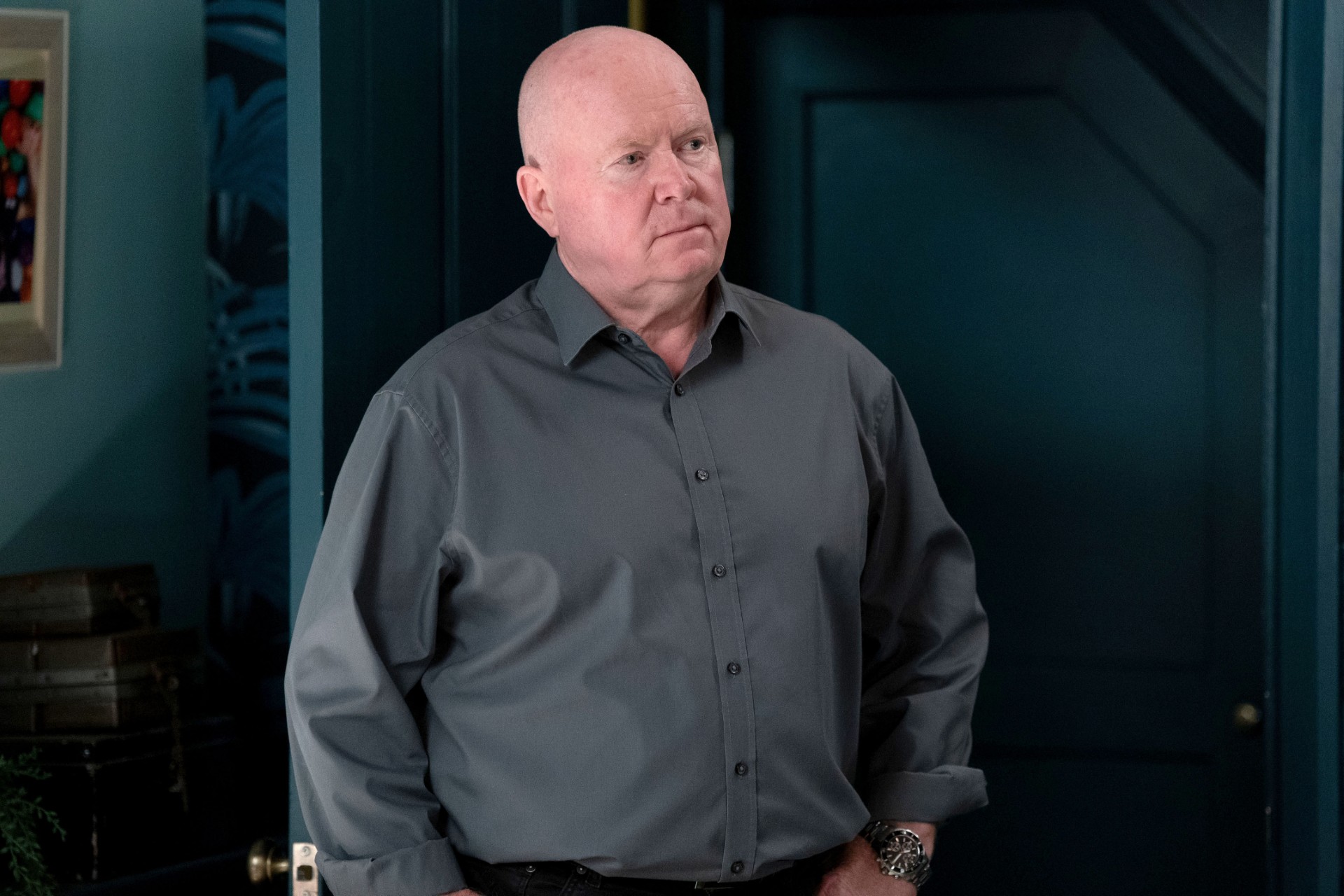 Phil looking cross in a green shirt 