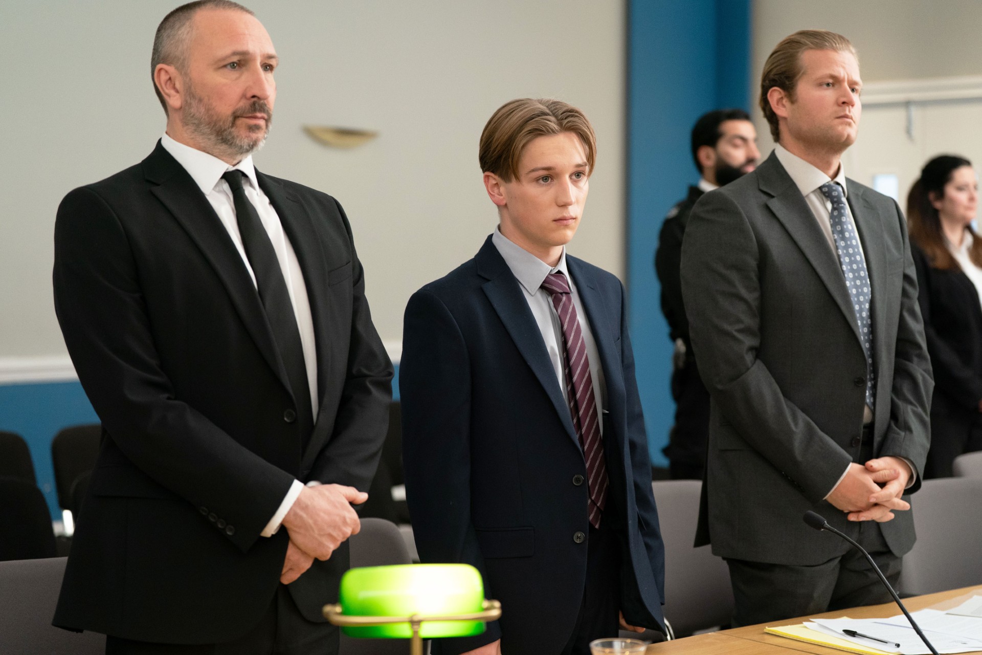 Joel in court standing next to Ross