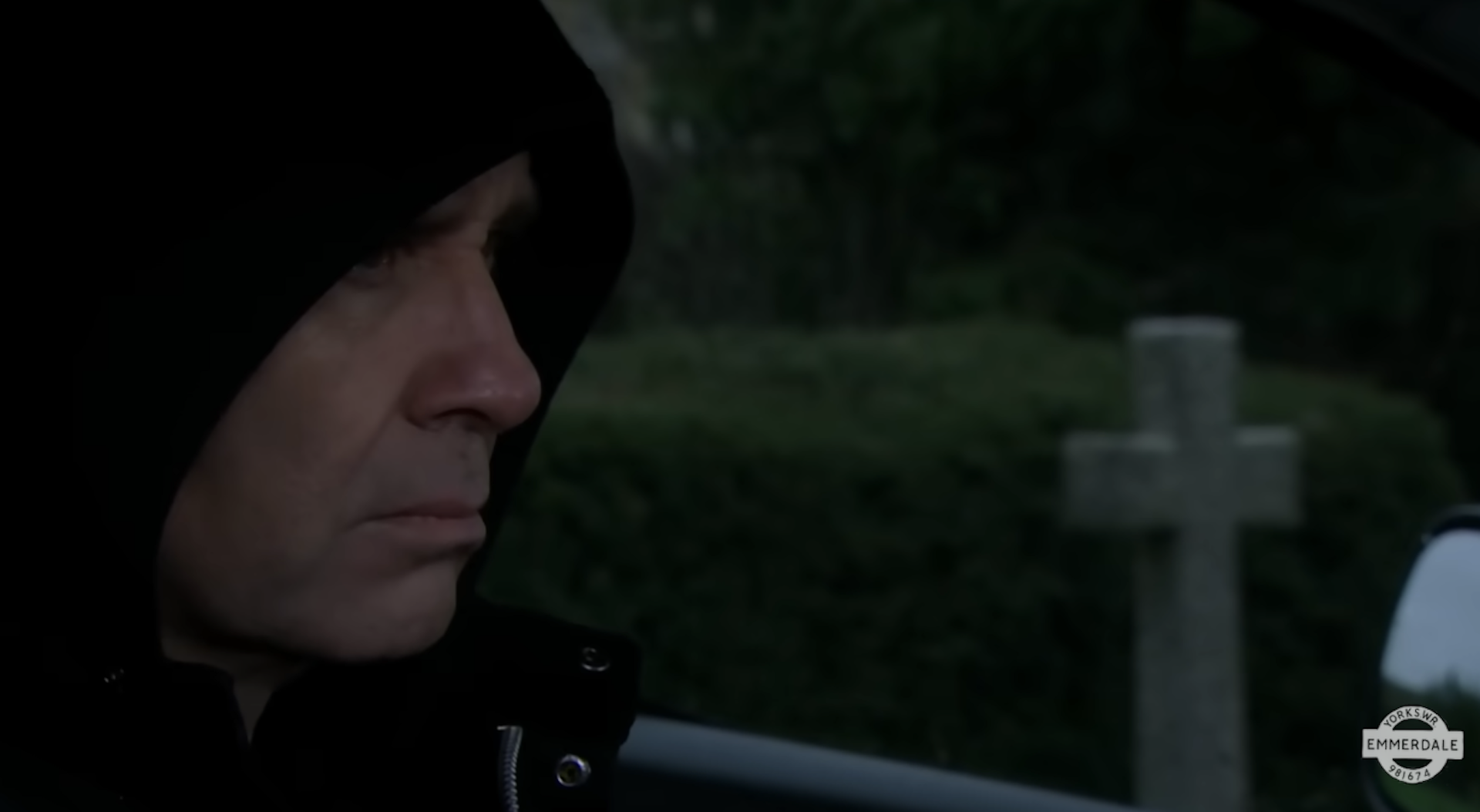 Graham in his car watching 