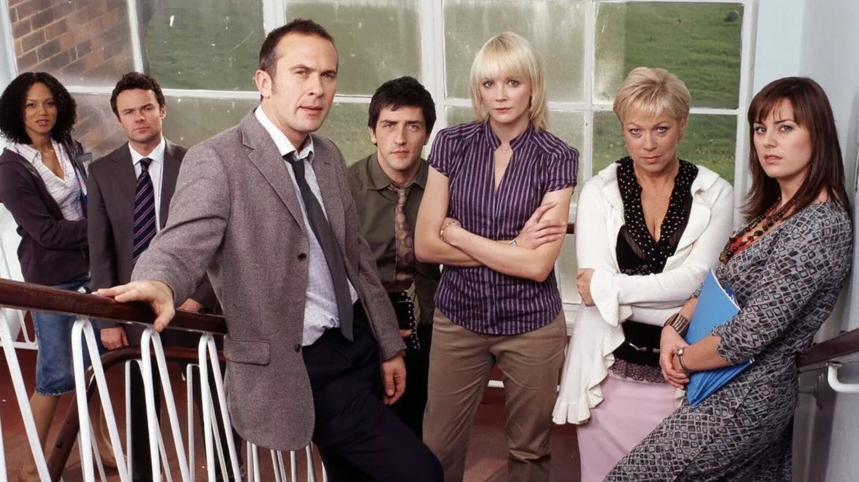 The original cast of Waterloo Road standing on the steps