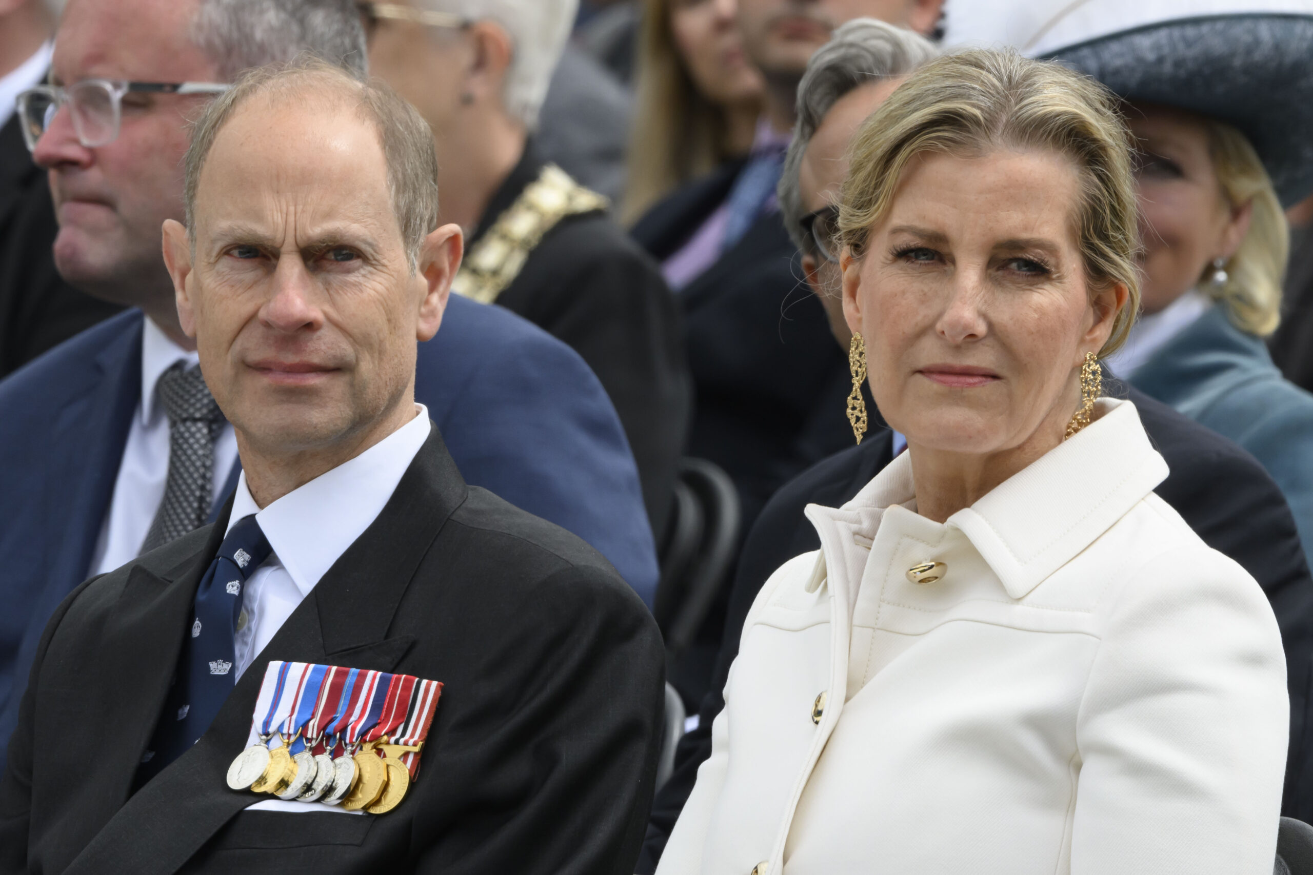 Prince Edward and Duchess Sophie with serious expressions