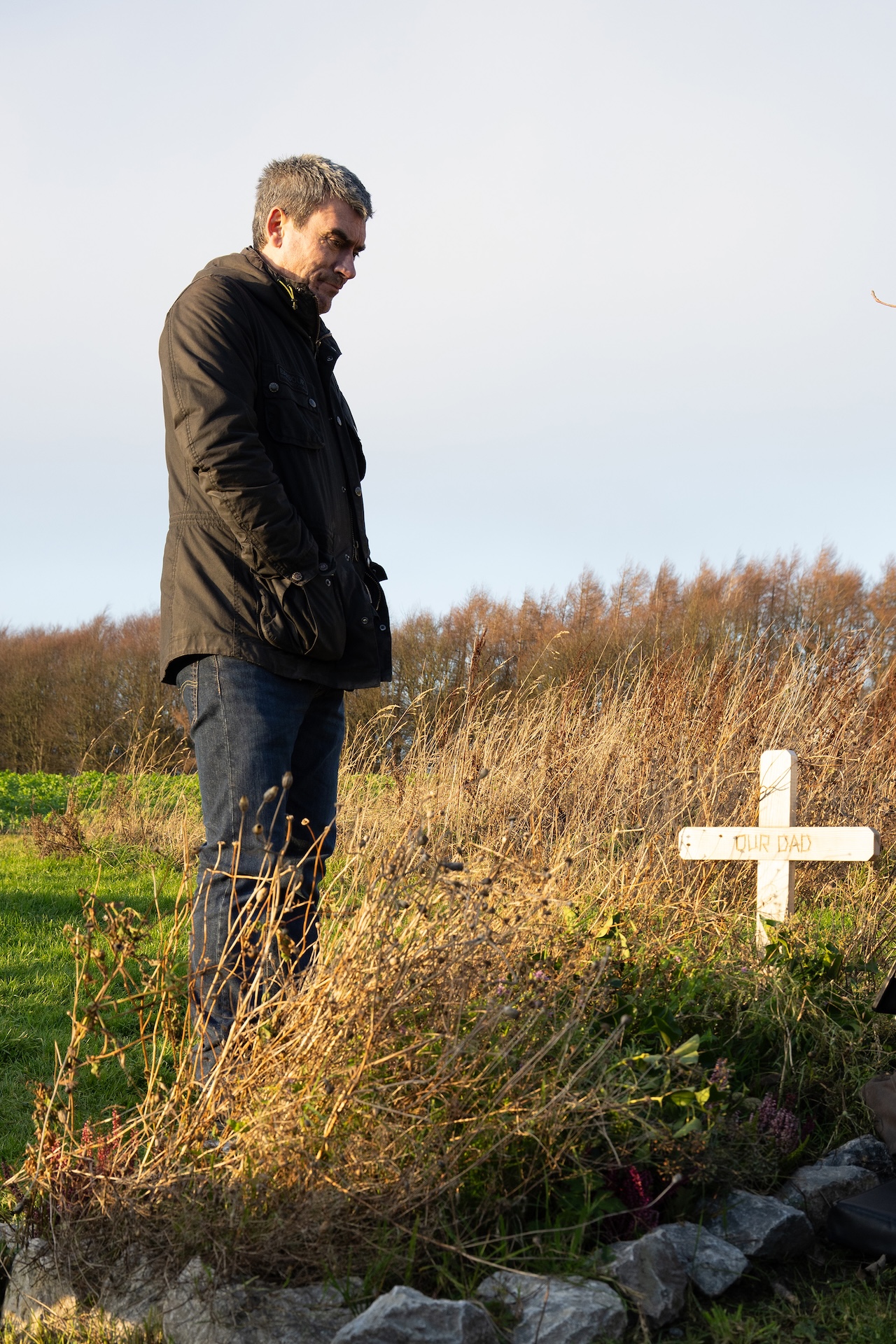 Cain is emotional at Zak's grave.