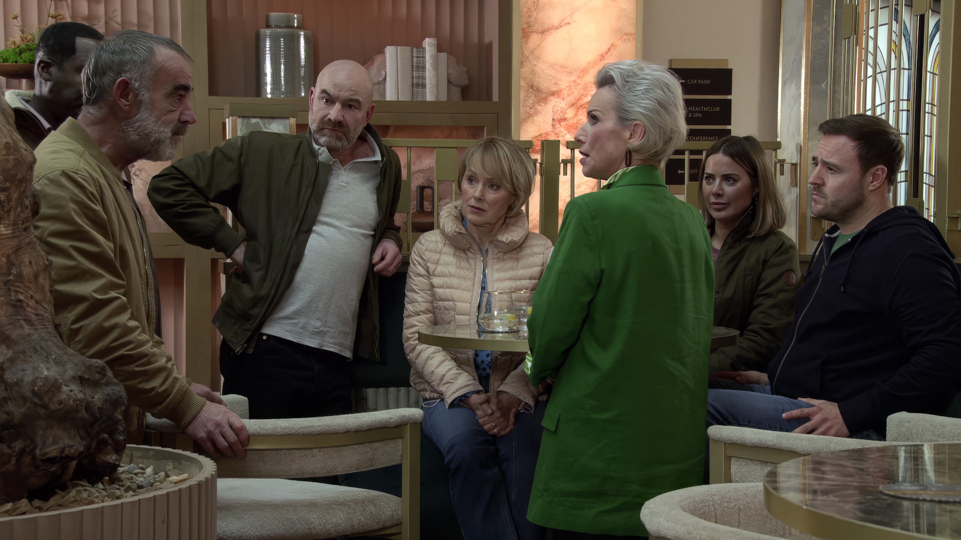 Coronation Street's Debbie talking to loved ones at the hotel