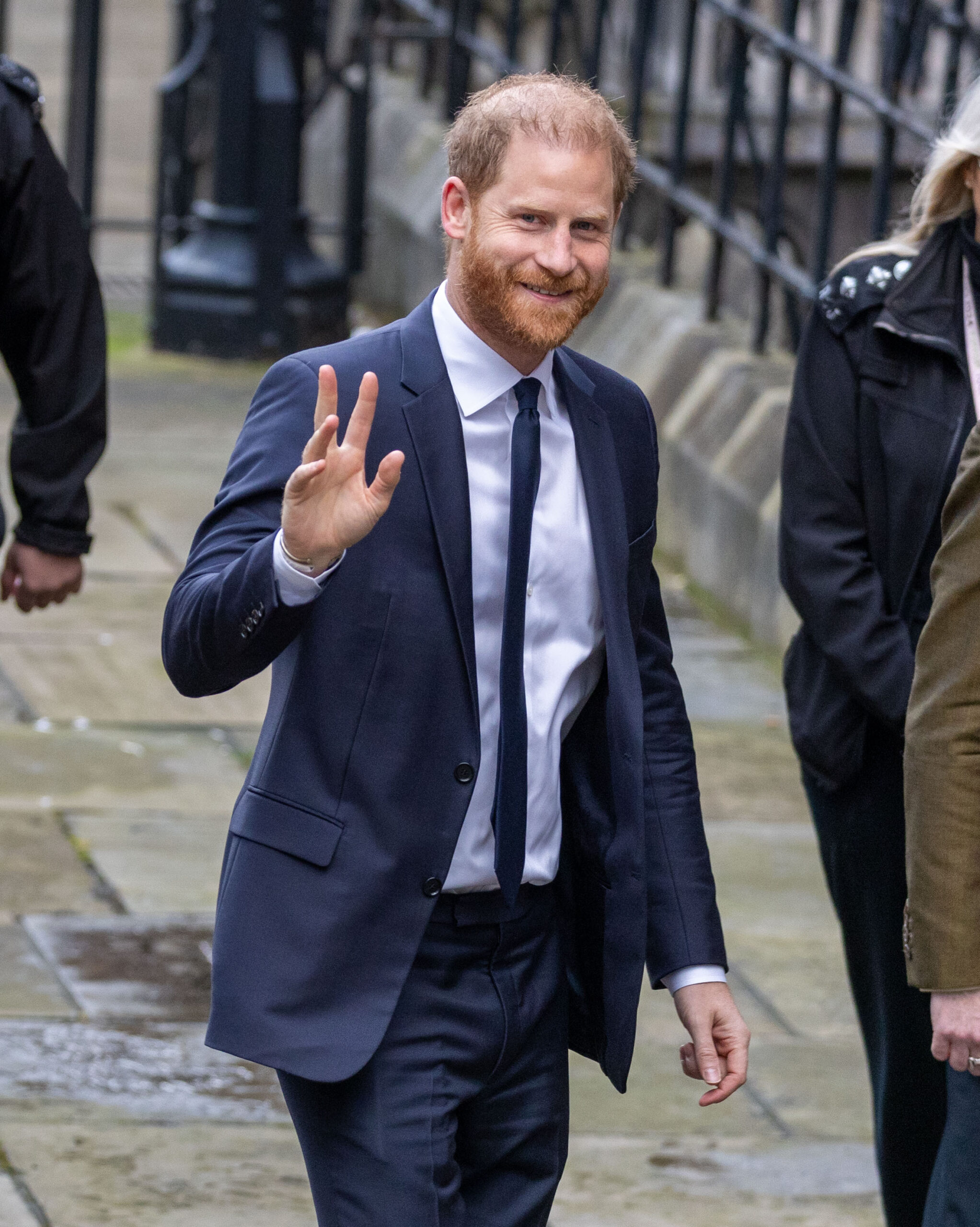 Prince Harry waving in suit in UK