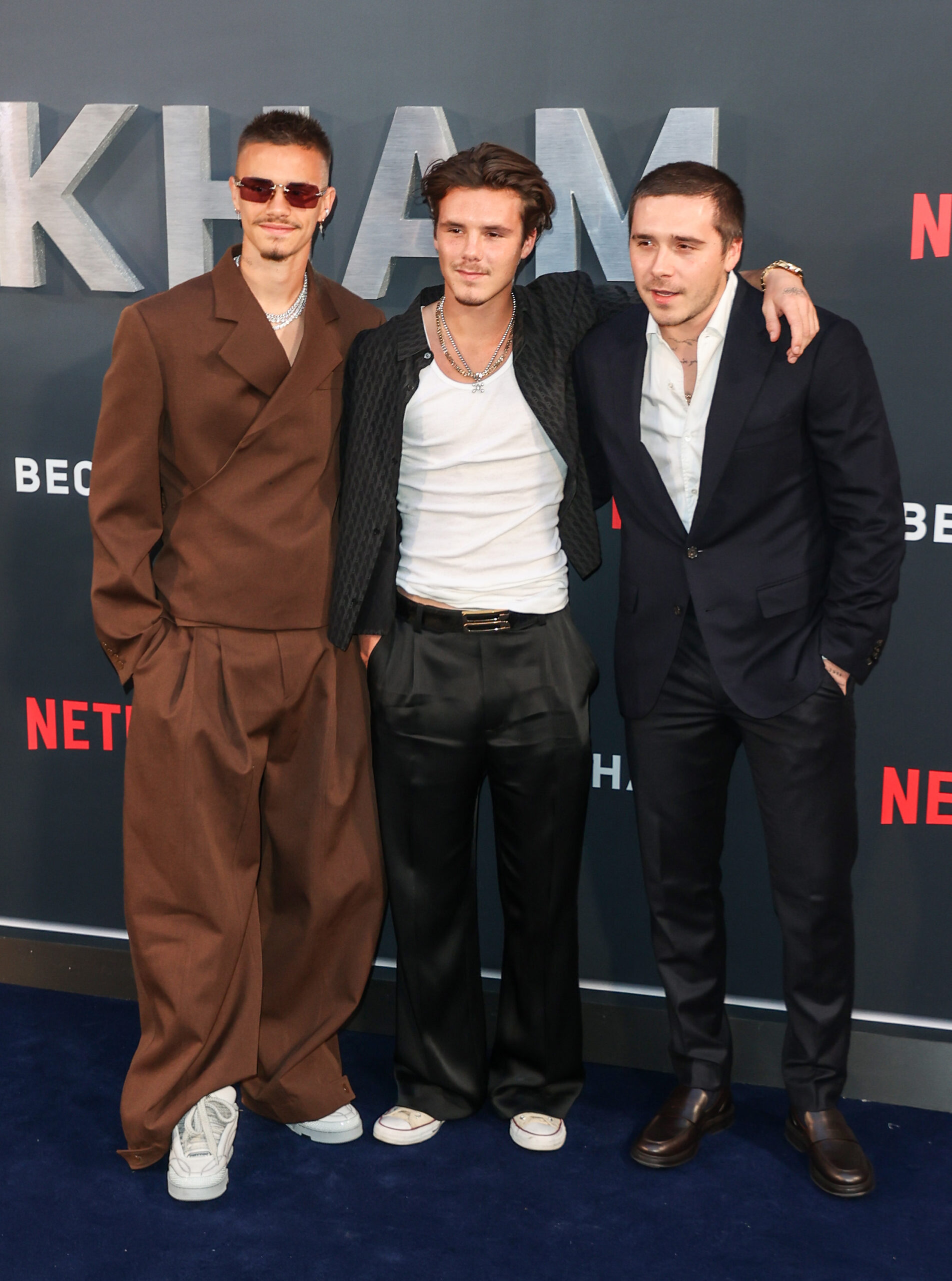 Brooklyn Beckham with his brothers at an event