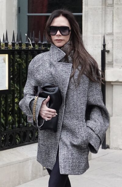 Victoria Beckham in a coat and sunglasses