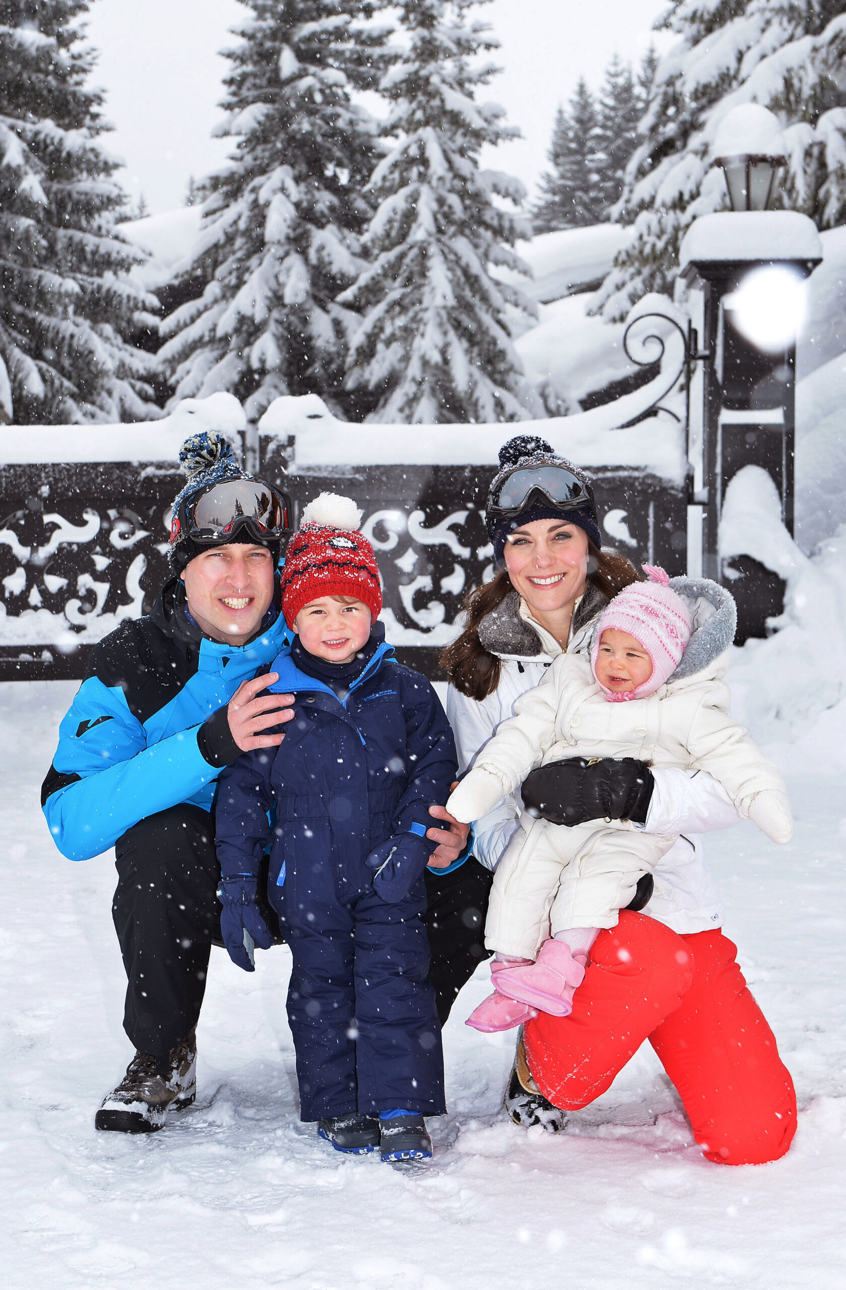 Prince William, Prince George, Princess Kate and Princess Charlotte smiling for a photo in the snow at the French Alps in 2016