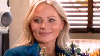 Coronation Street's Lisa smiling with flowers