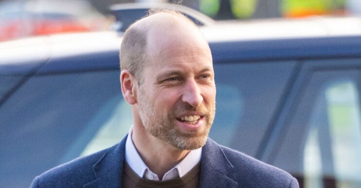 Prince William smiling in blue blazer in Scotland