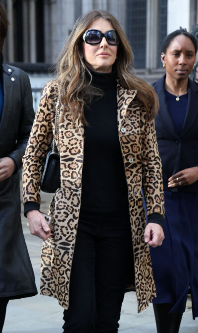 Elizabeth Hurley and Damian Hurley arrive at court during a court case against Associated Newspapers Ltd at The Royal Courts of Justice, Elizabeth wearing an animal print coat
