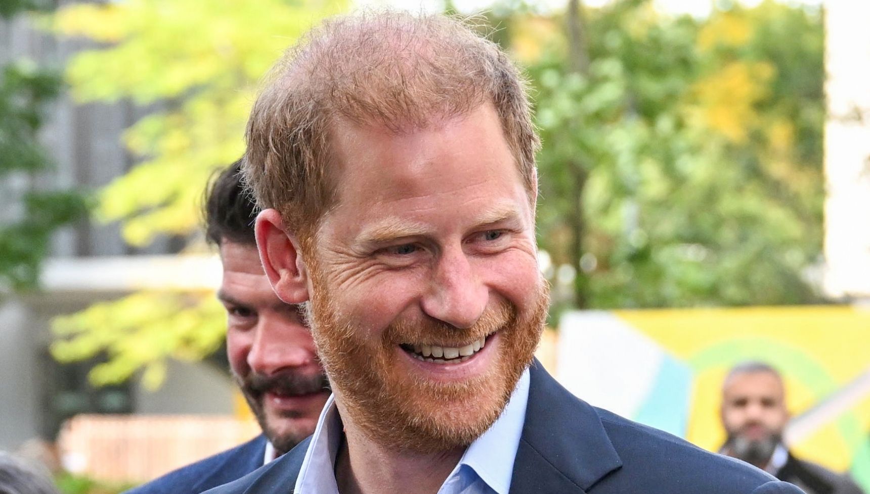 Prince Harry smiling during UK return