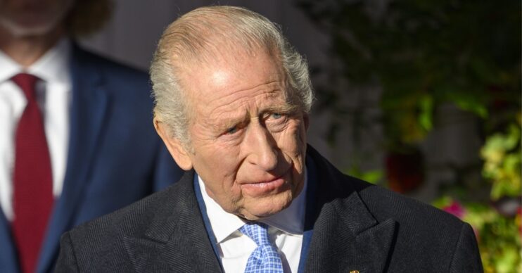 King Charles frowning during state visit