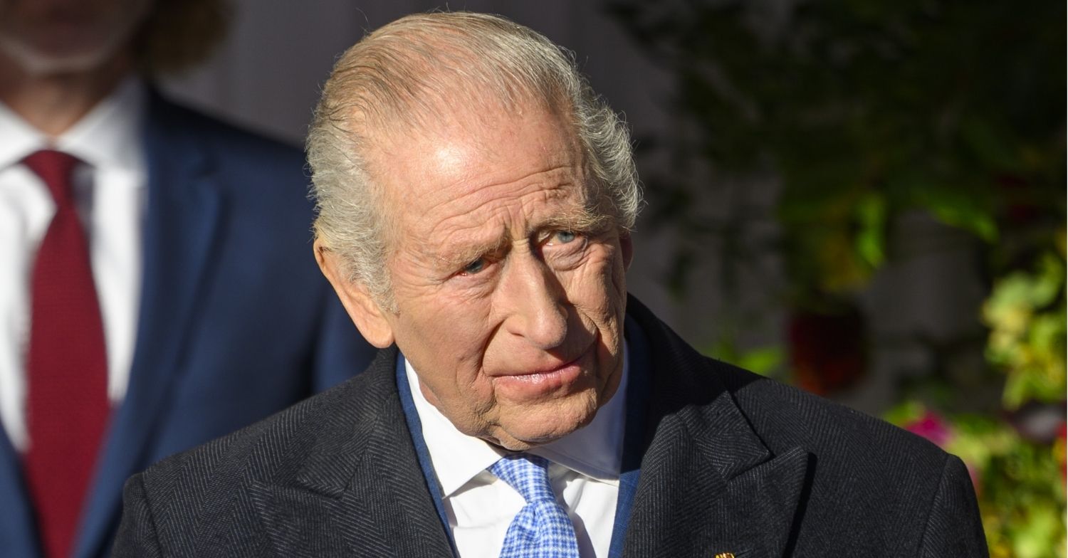 King Charles frowning during state visit