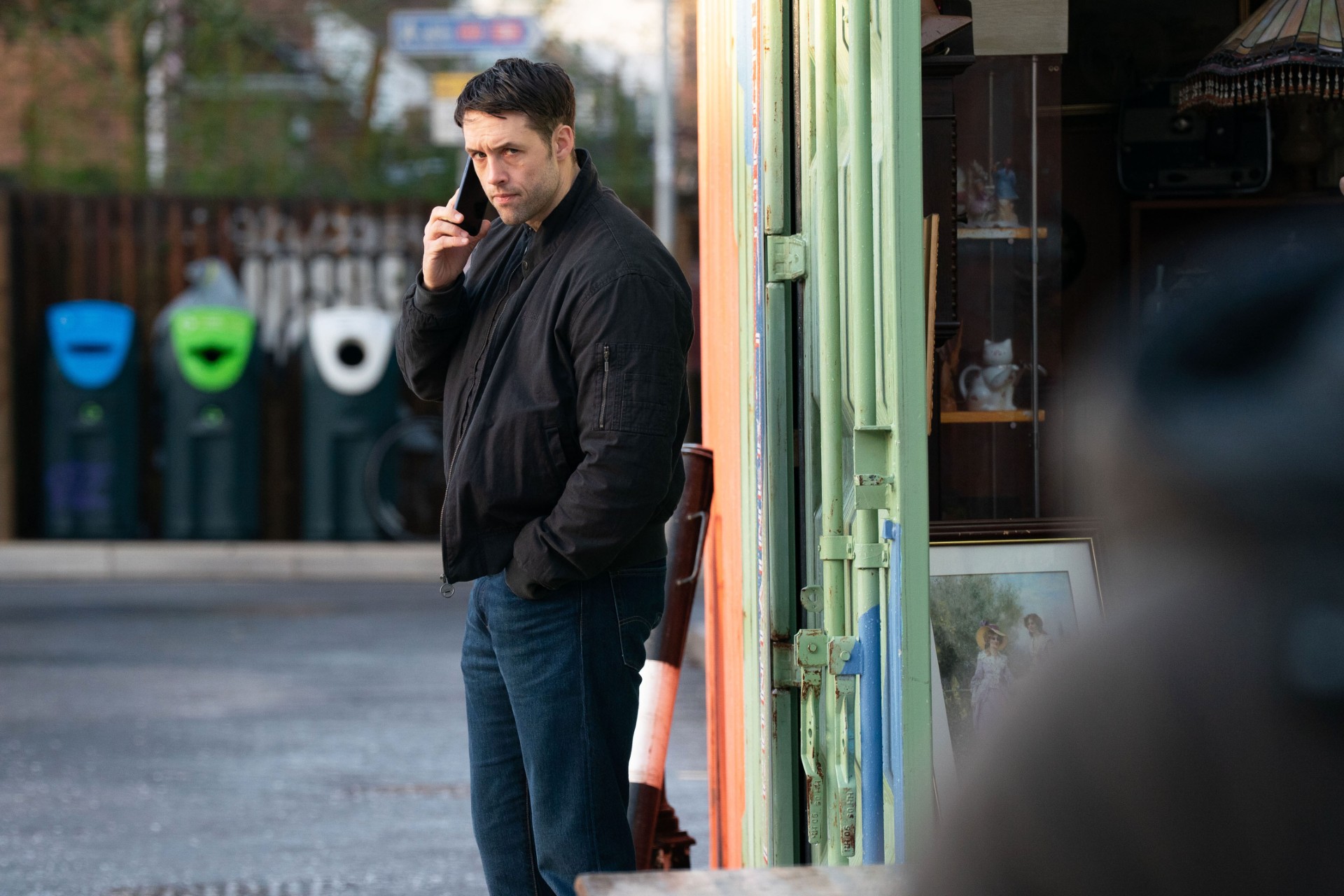 Mark on the phone watching someone from afar in EastEnders spoilers for next week