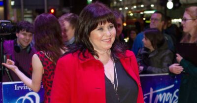 red carpet coleen in red jacket