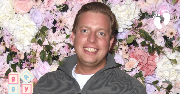 Thomas Skinner against a flower wall