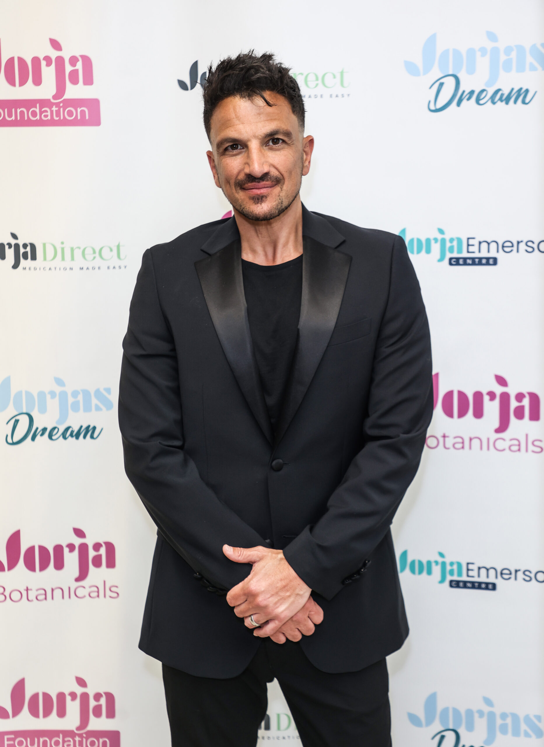 Peter Andre in a black suit