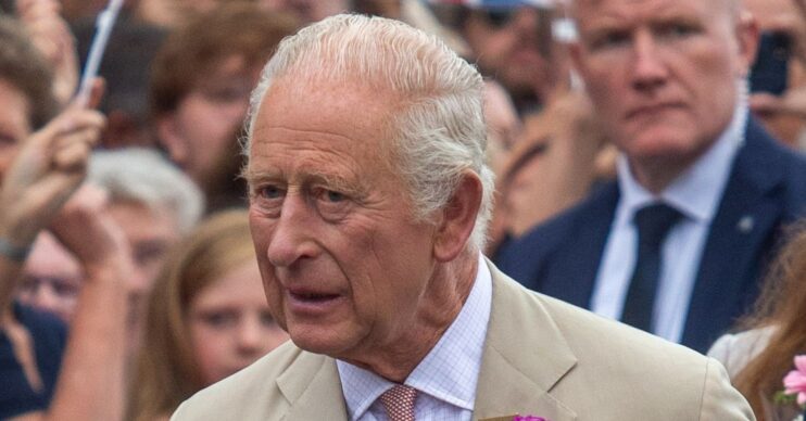 King Charles in beige suit