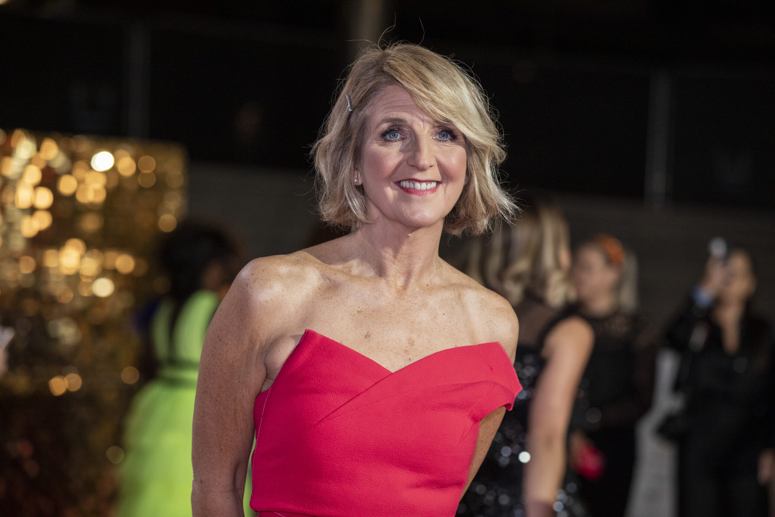 Kaye Adams in a red dress