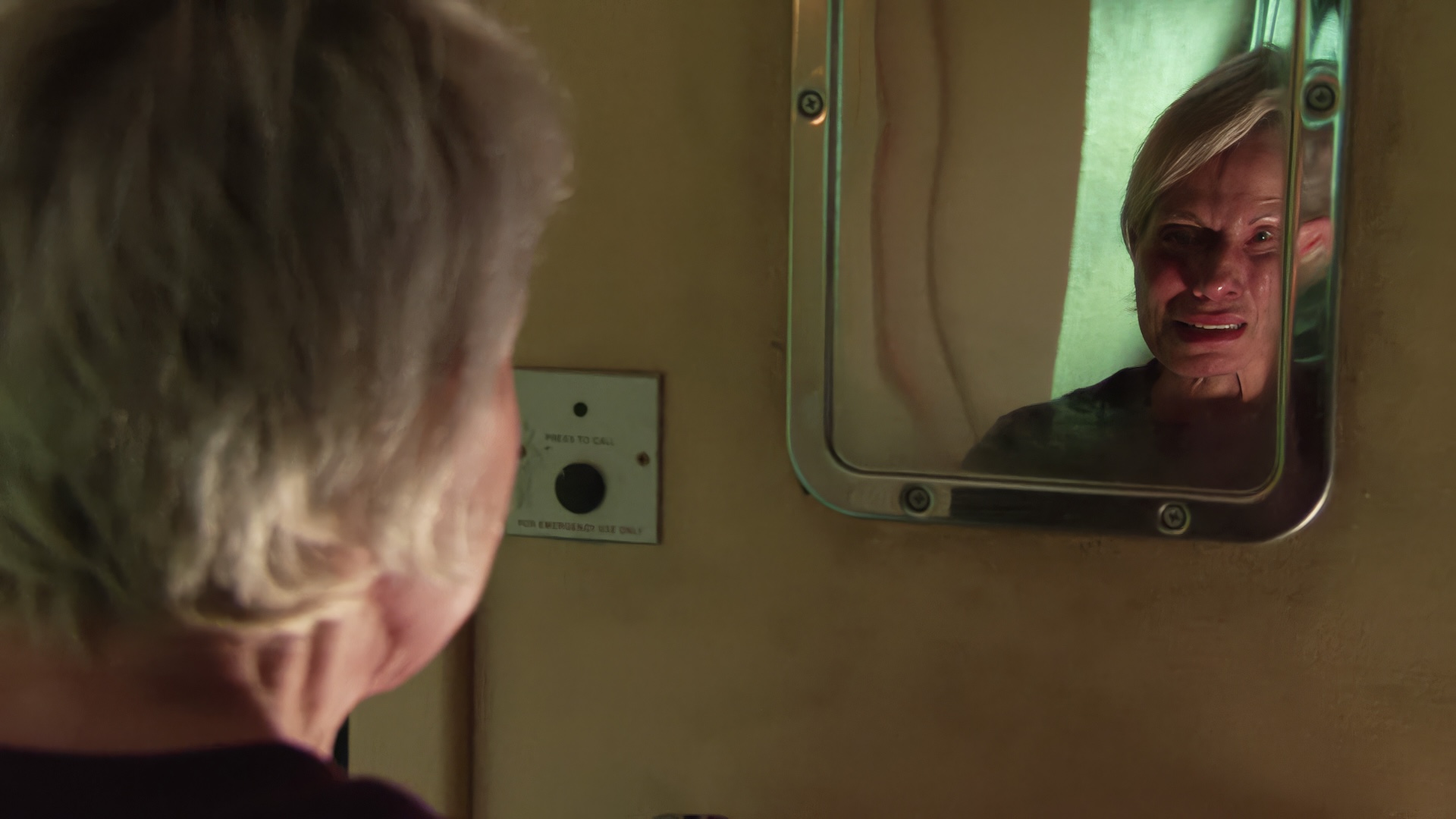 Debbie crying in prison mirror