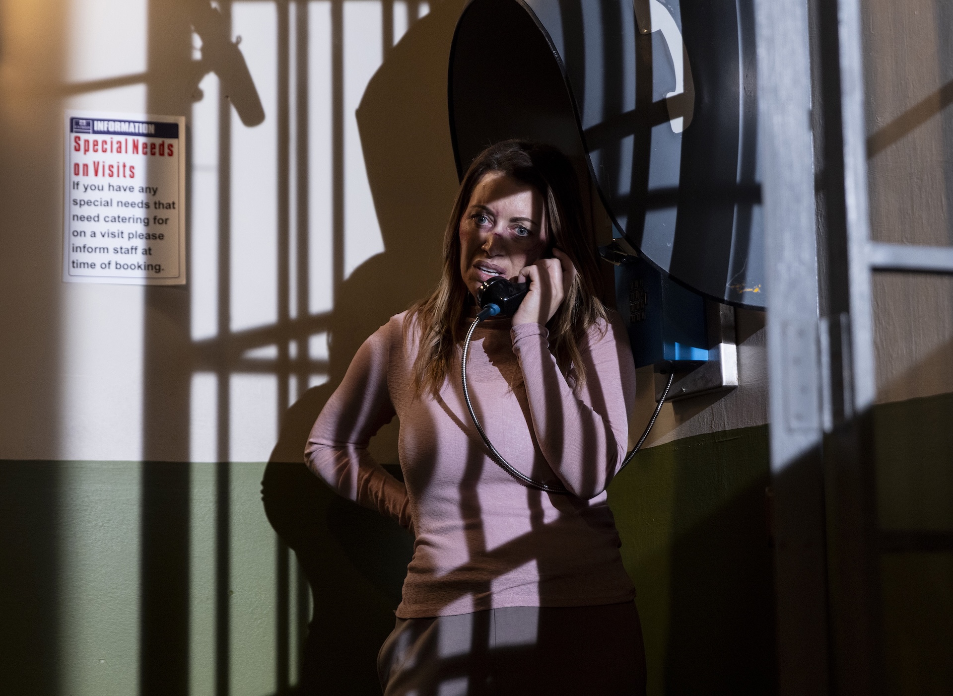 Lou on phone in prison in Coronation Street