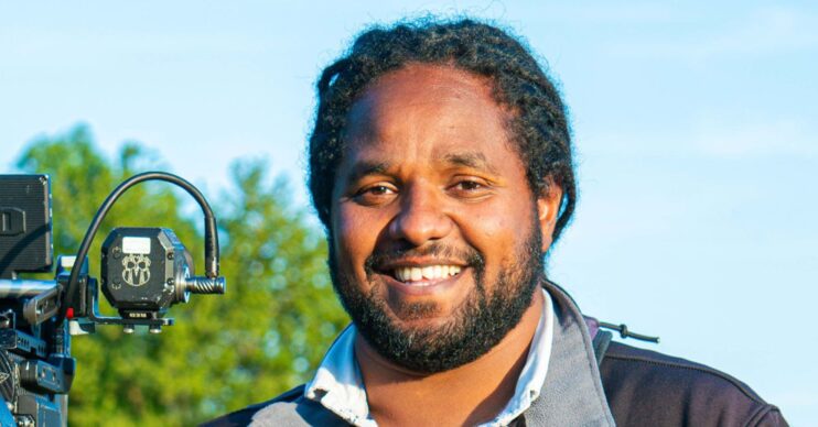 Hamza Yassin smiling at the camera