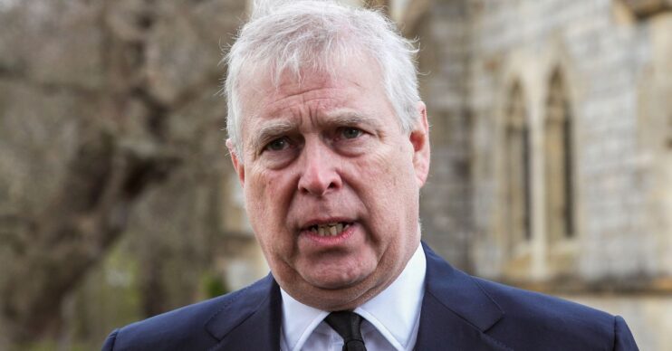 Andrew Mountbatten-Windsor talking with an unhappy expression