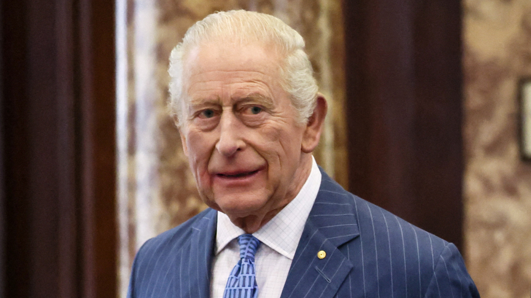 King Charles in blue suit