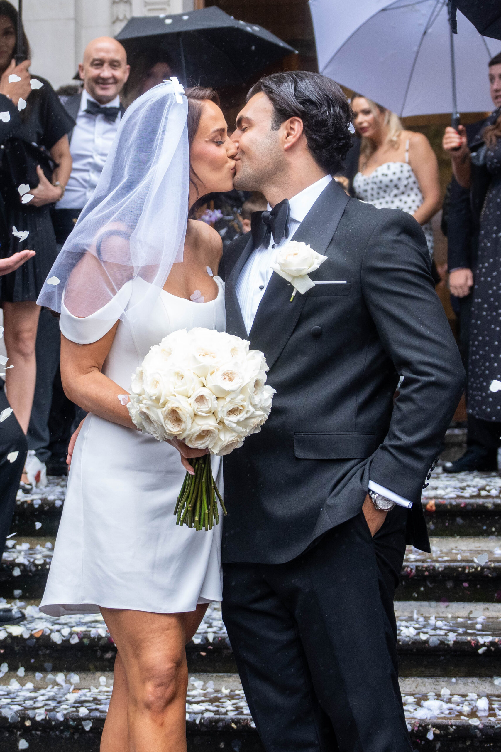 Vicky Pattison on her wedding day kissing her husband