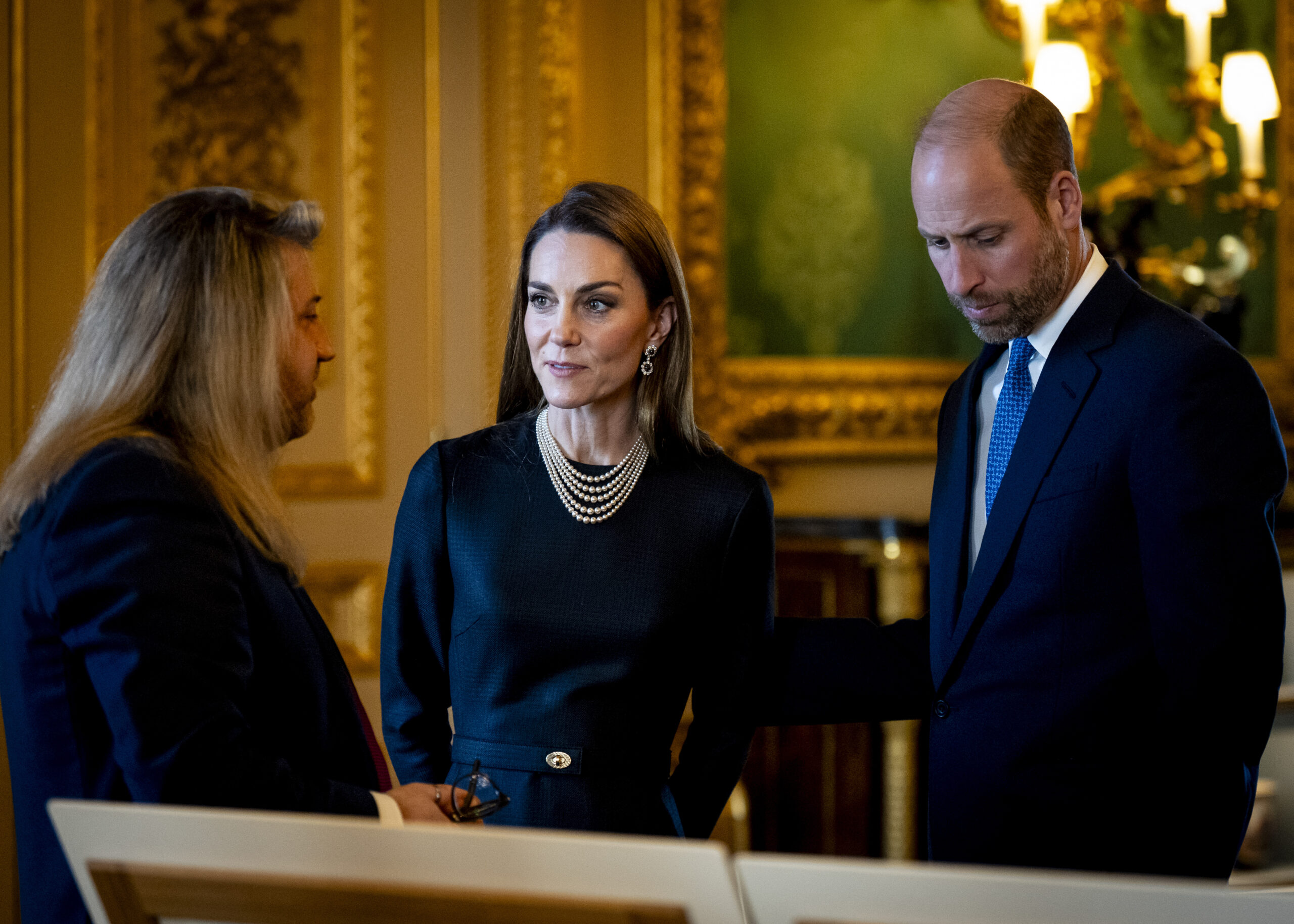 Kate and William looking at art