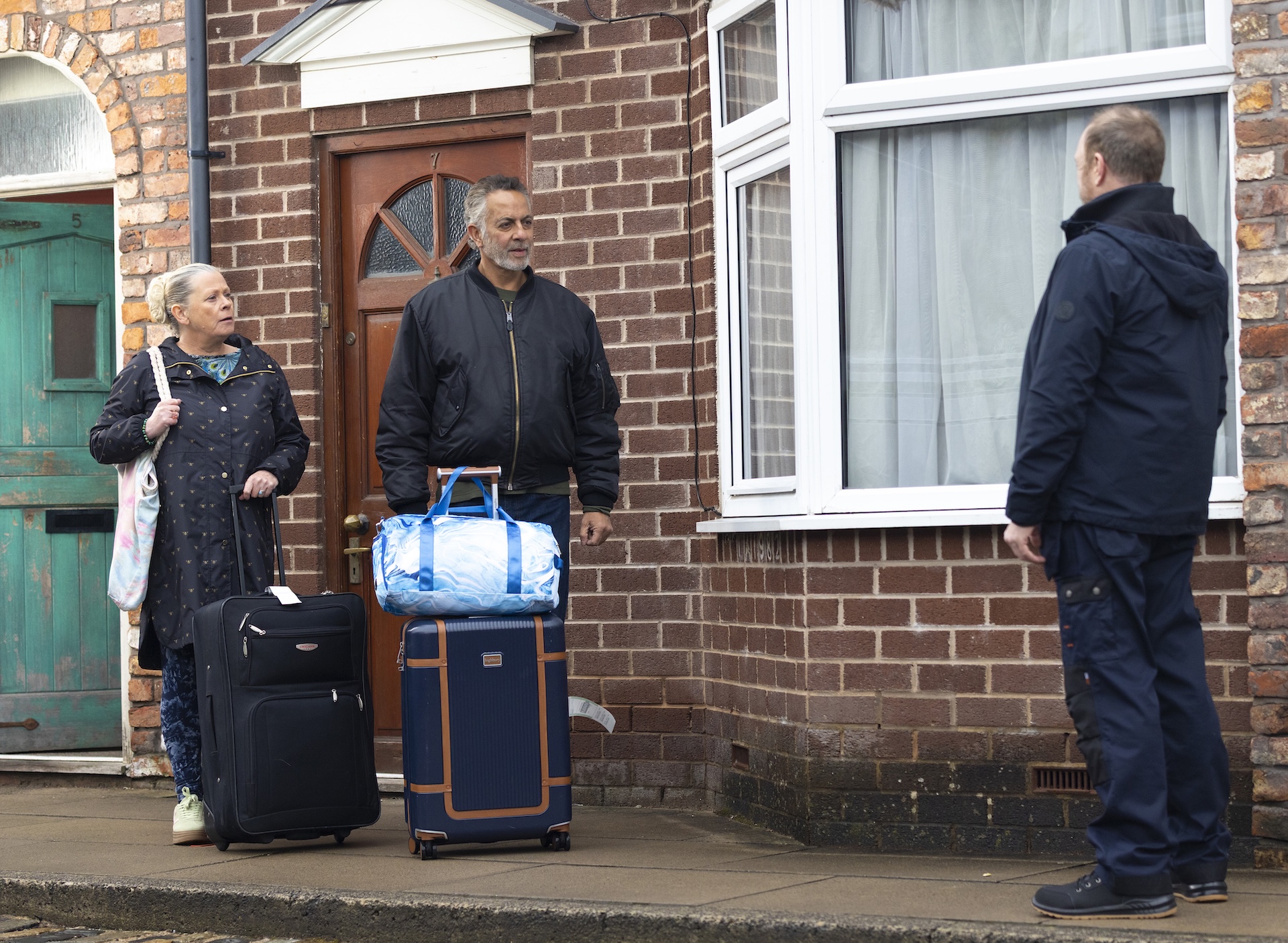 Bernie, Dev and Mal talking on Coronation Street