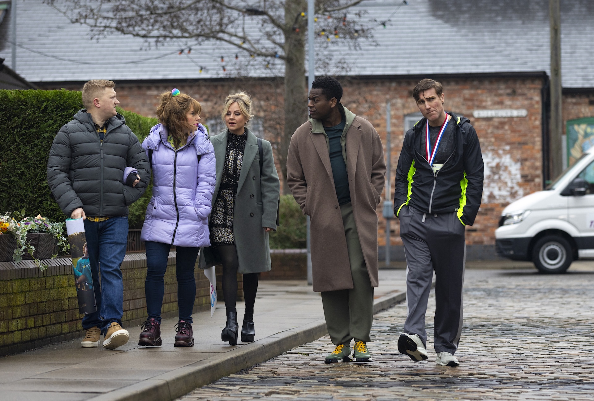 Chesney, Gemma, Sarah, James, Theo walking on the Street