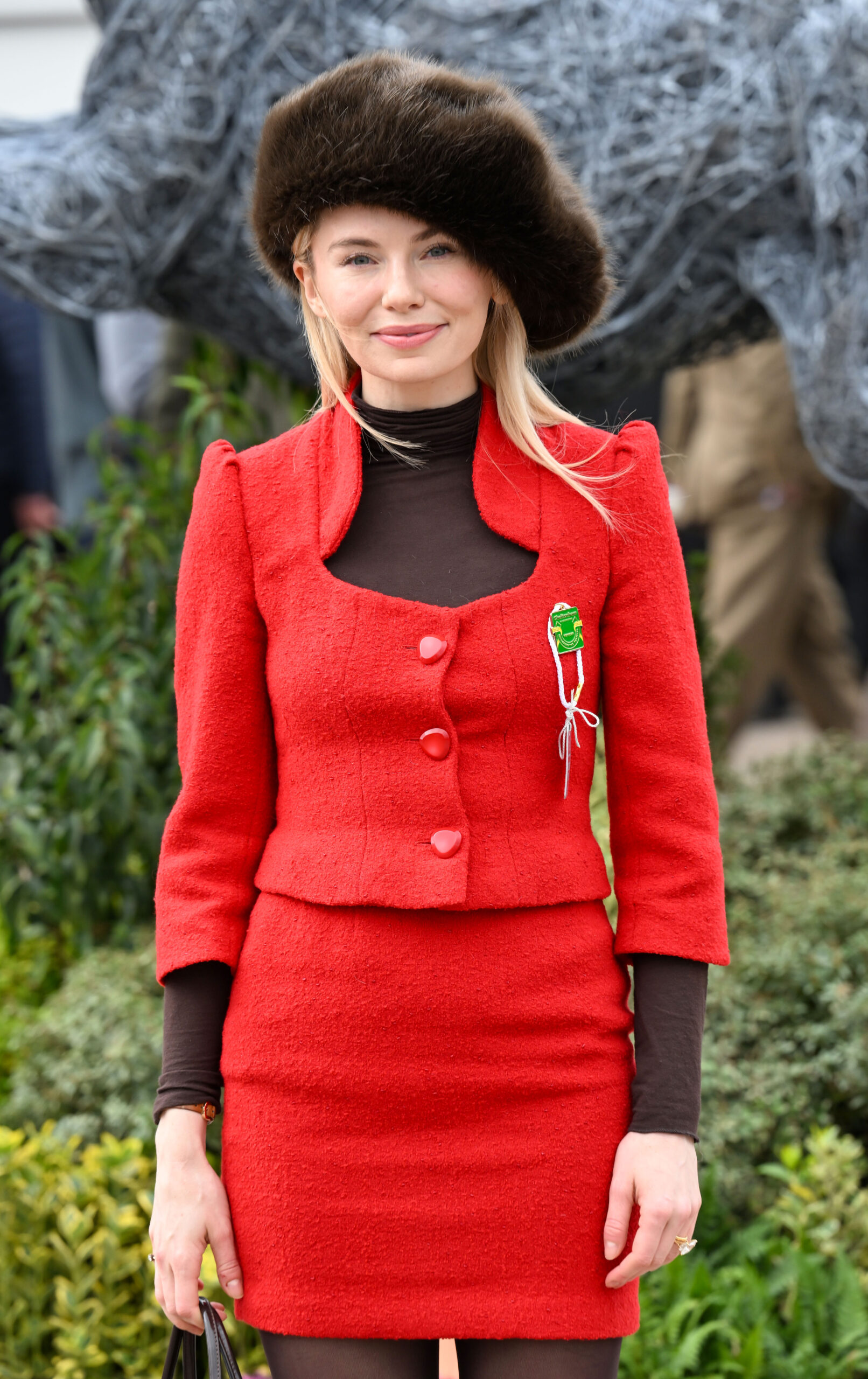 Georgia Toffolo at Cheltenham wearing red