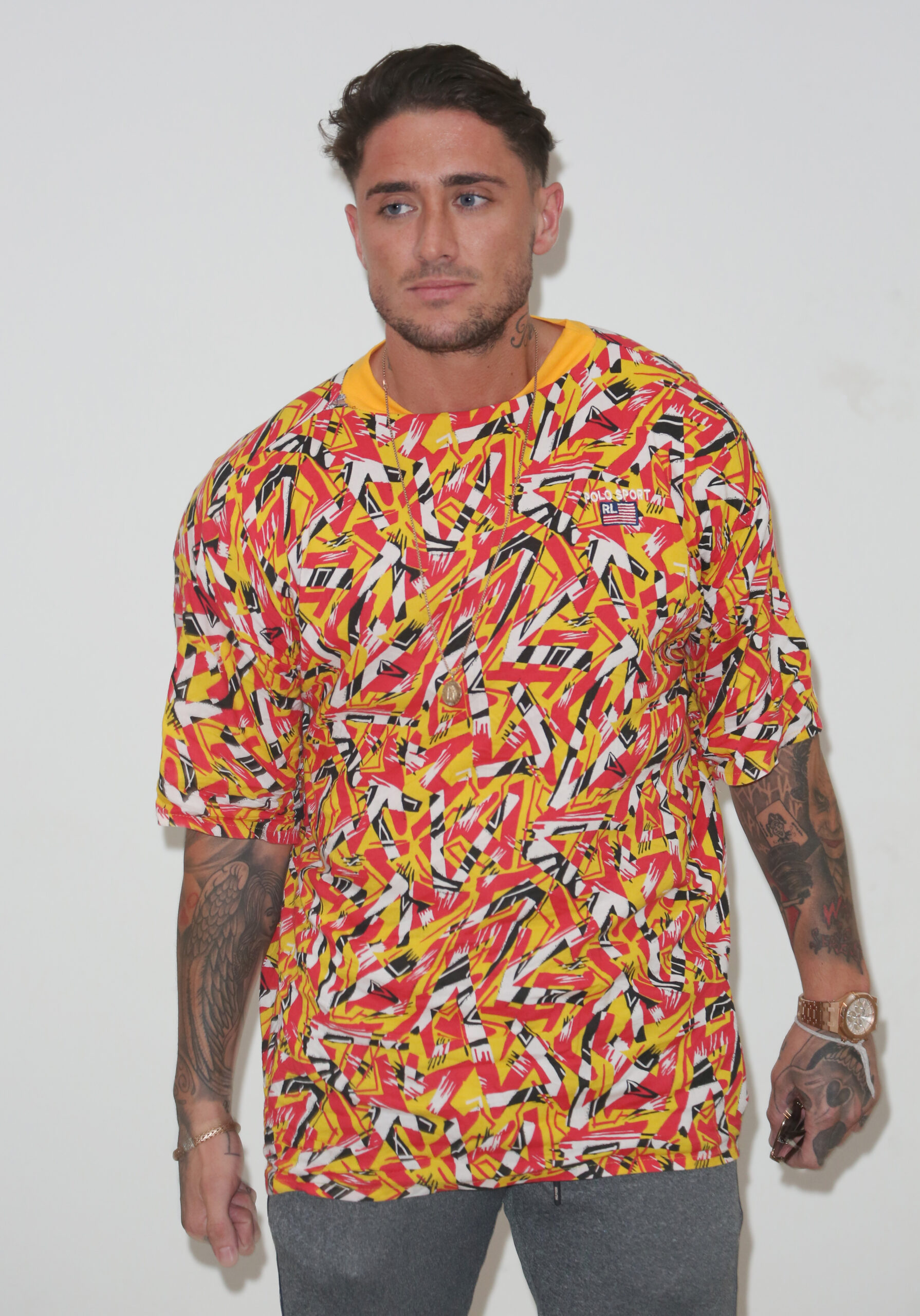 Stephen Bear in a bright orange top