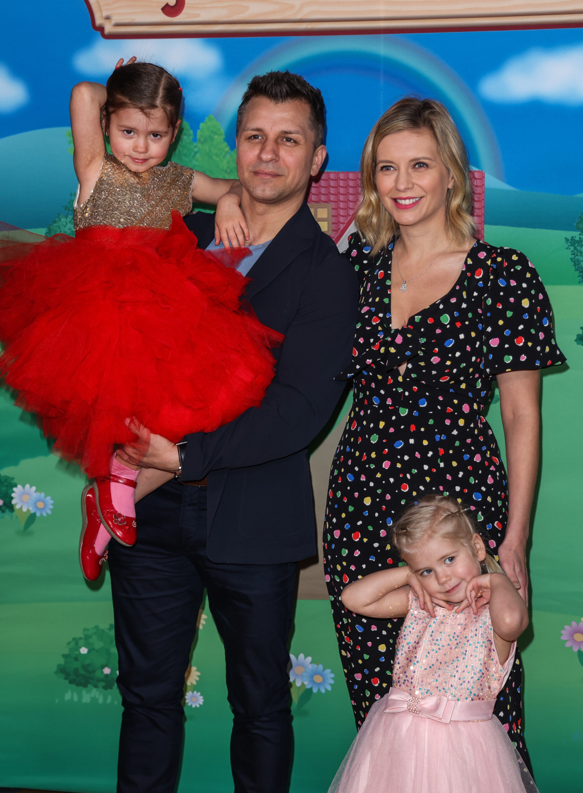 Pasha, Rachel Riley and their two daughters at an event