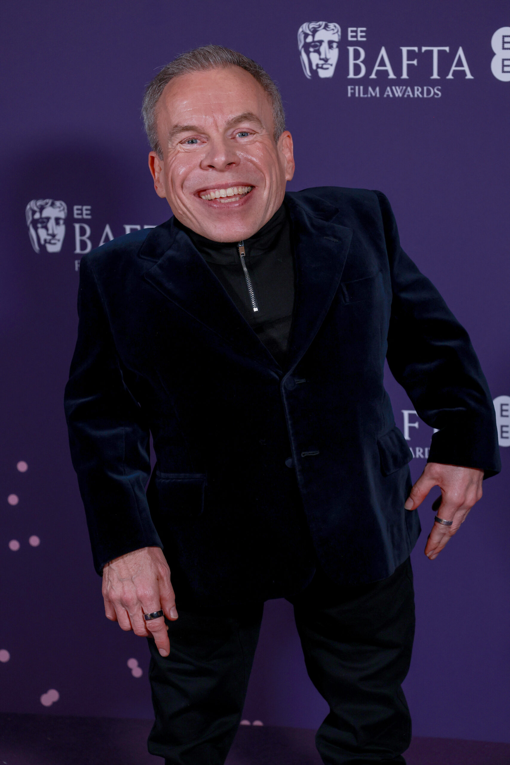 Warwick Davis smiling