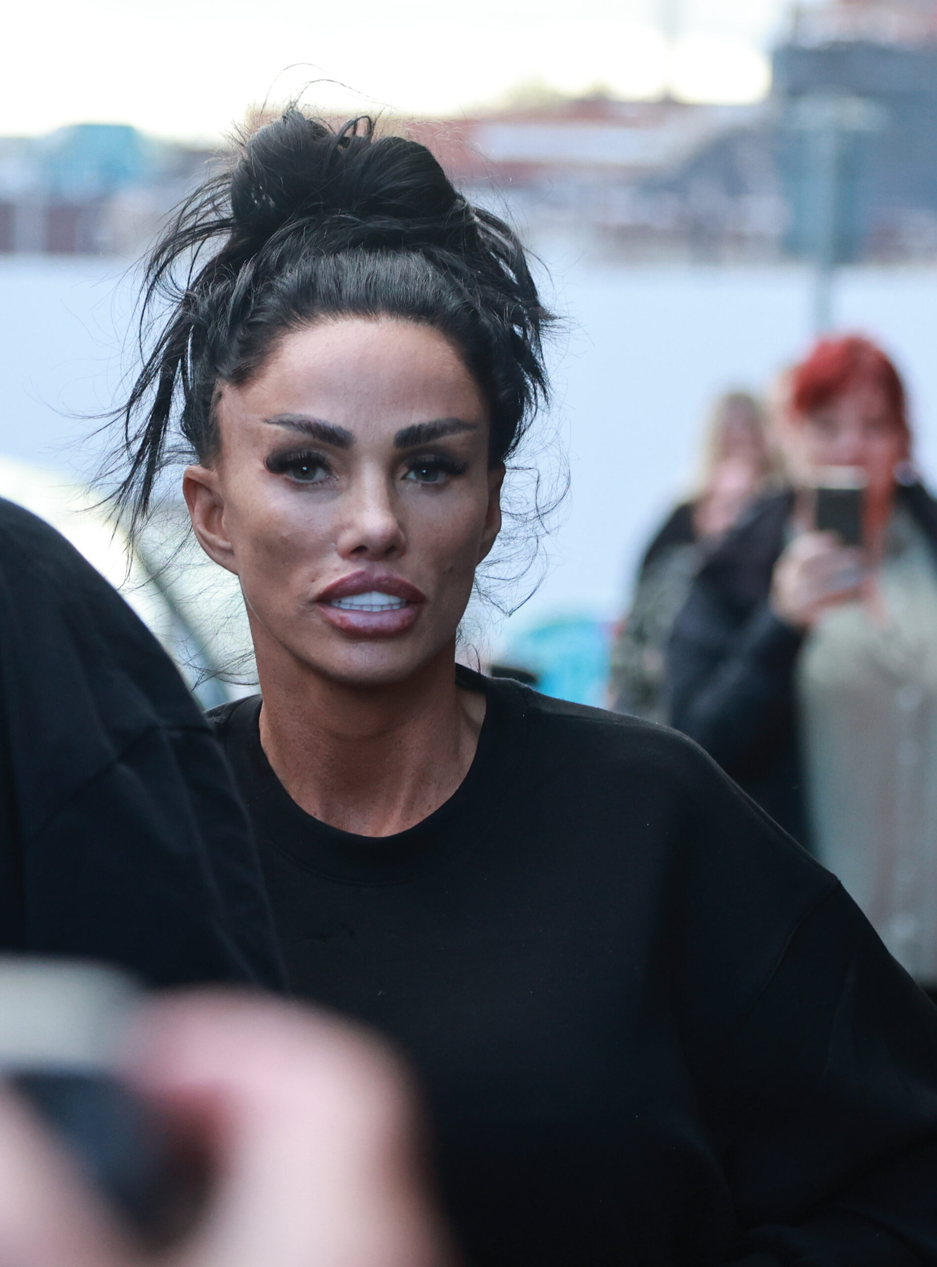Katie Price wearing black with her hair up