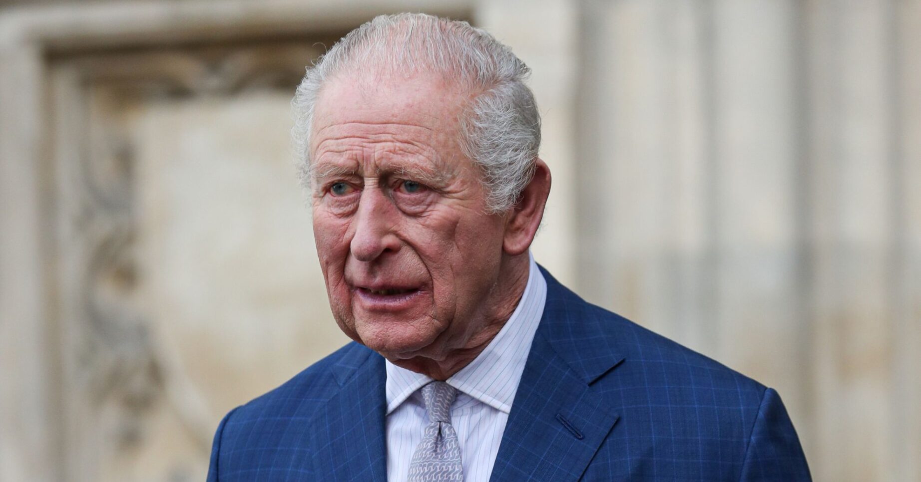 King Charles in blue suit