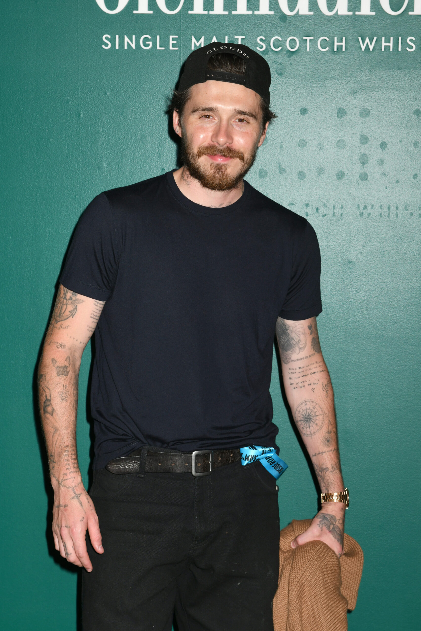 Brooklyn Beckham posing at event