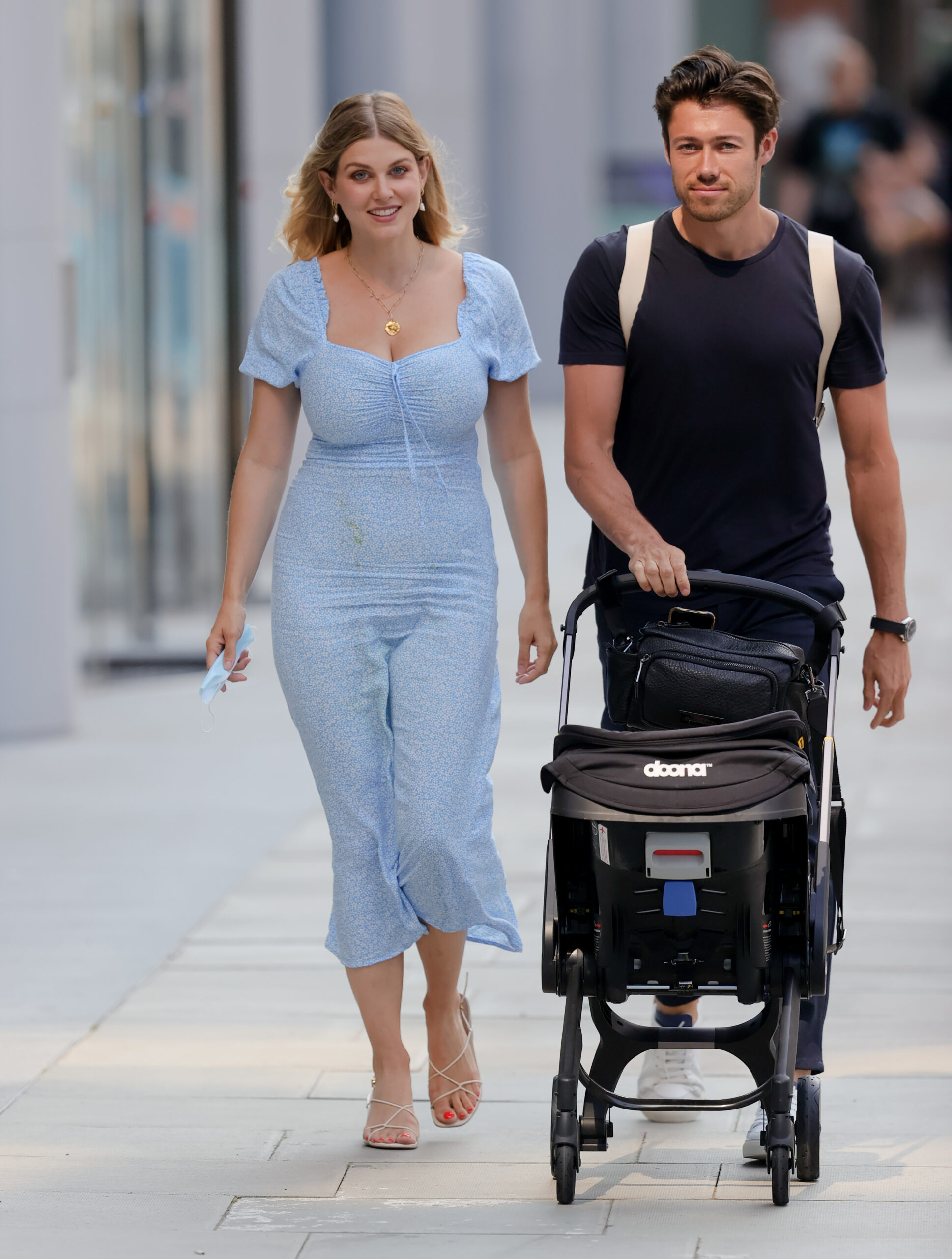 Ashley James and Tommy Andrews walking with a pram