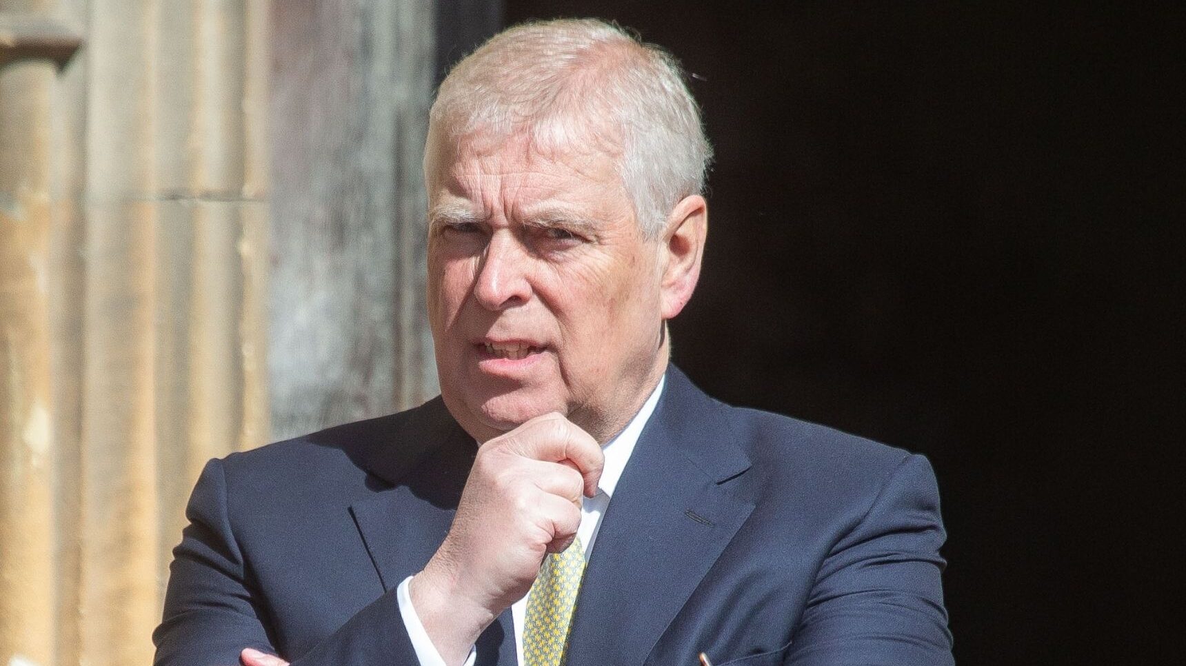 Andrew Mountbatten-Windsor with his hand on his chin