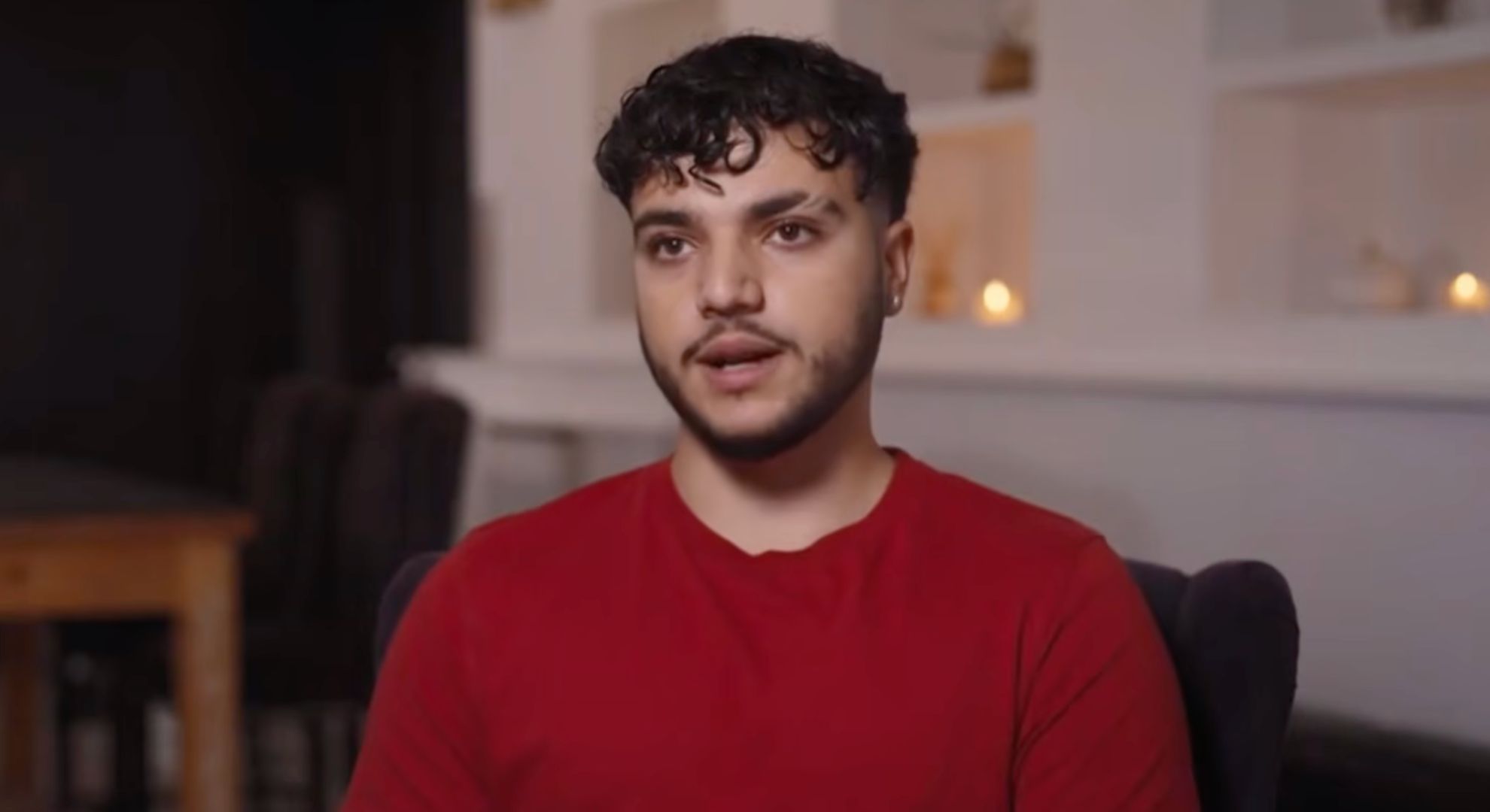 Junior Andre in red T shirt