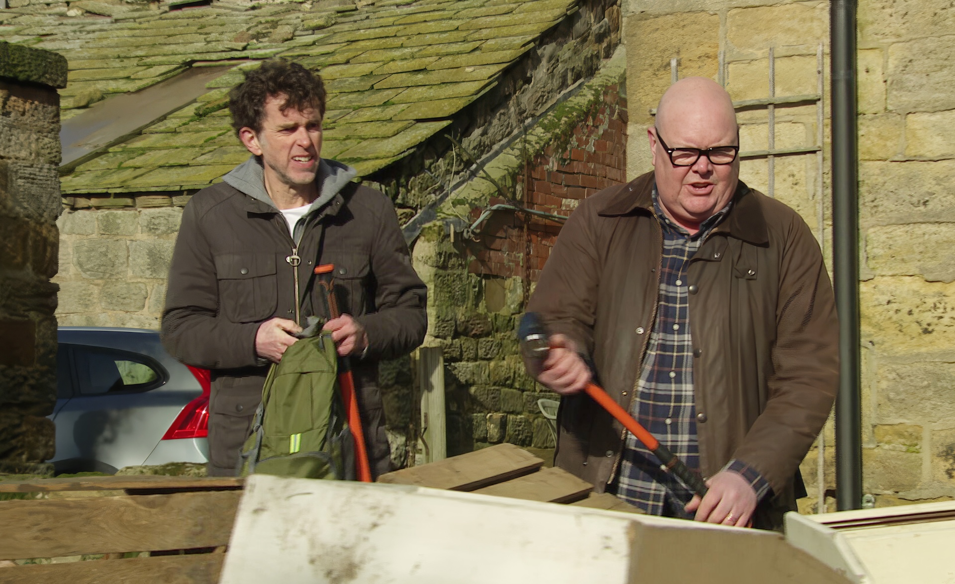 Marlon and Paddy with sledgehammers at the farm