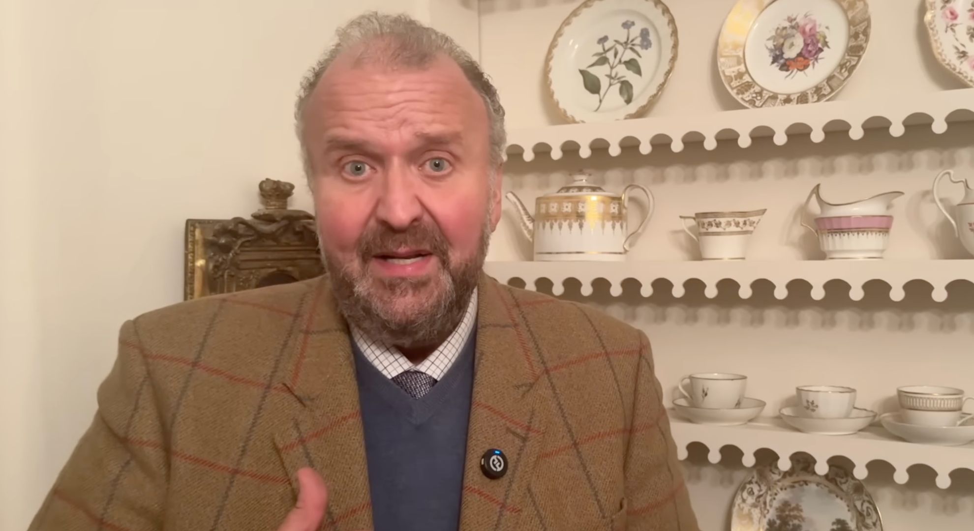 James Lewis speaking to camera 