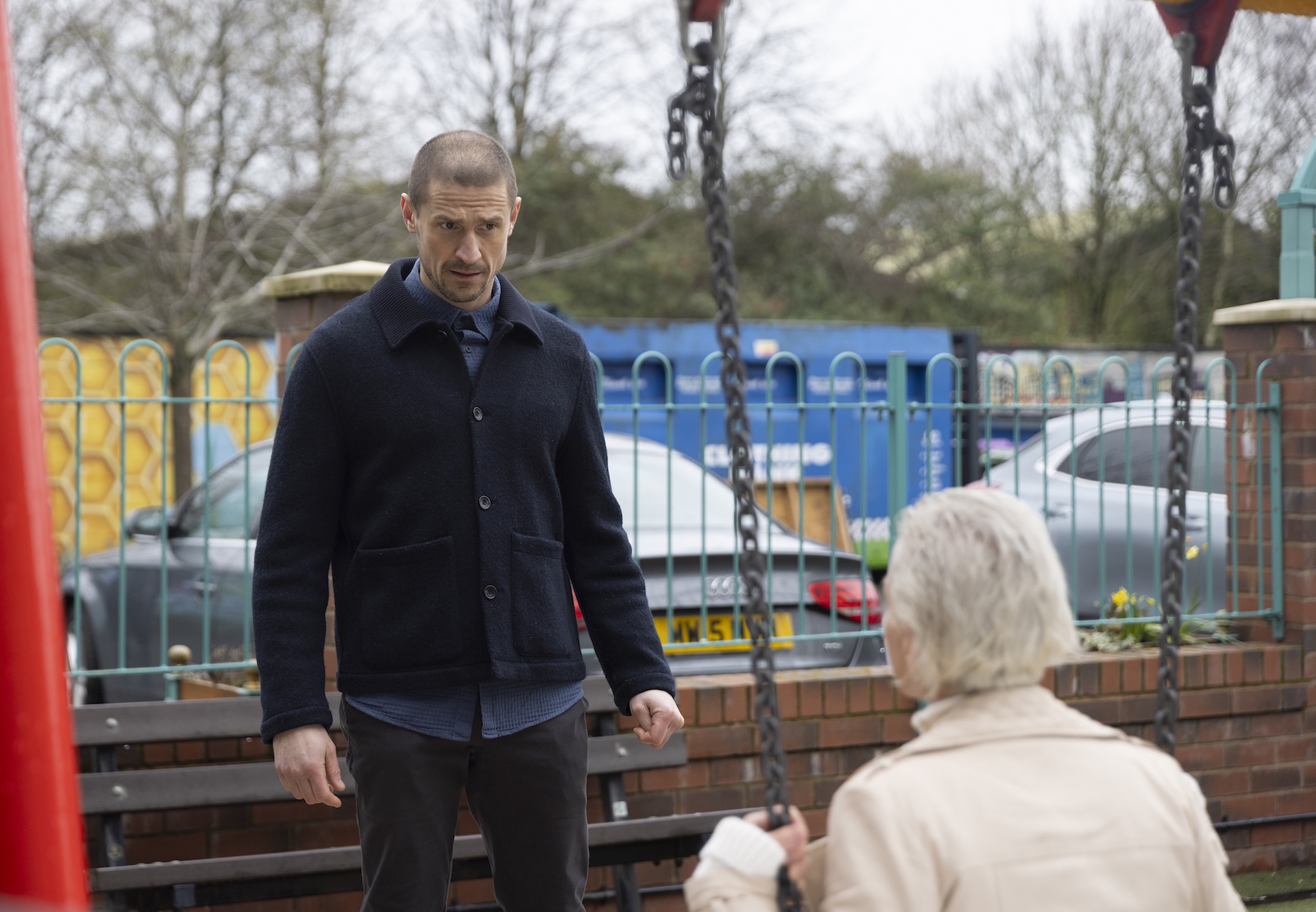 Carl and Debbie at the swings in Coronation Street