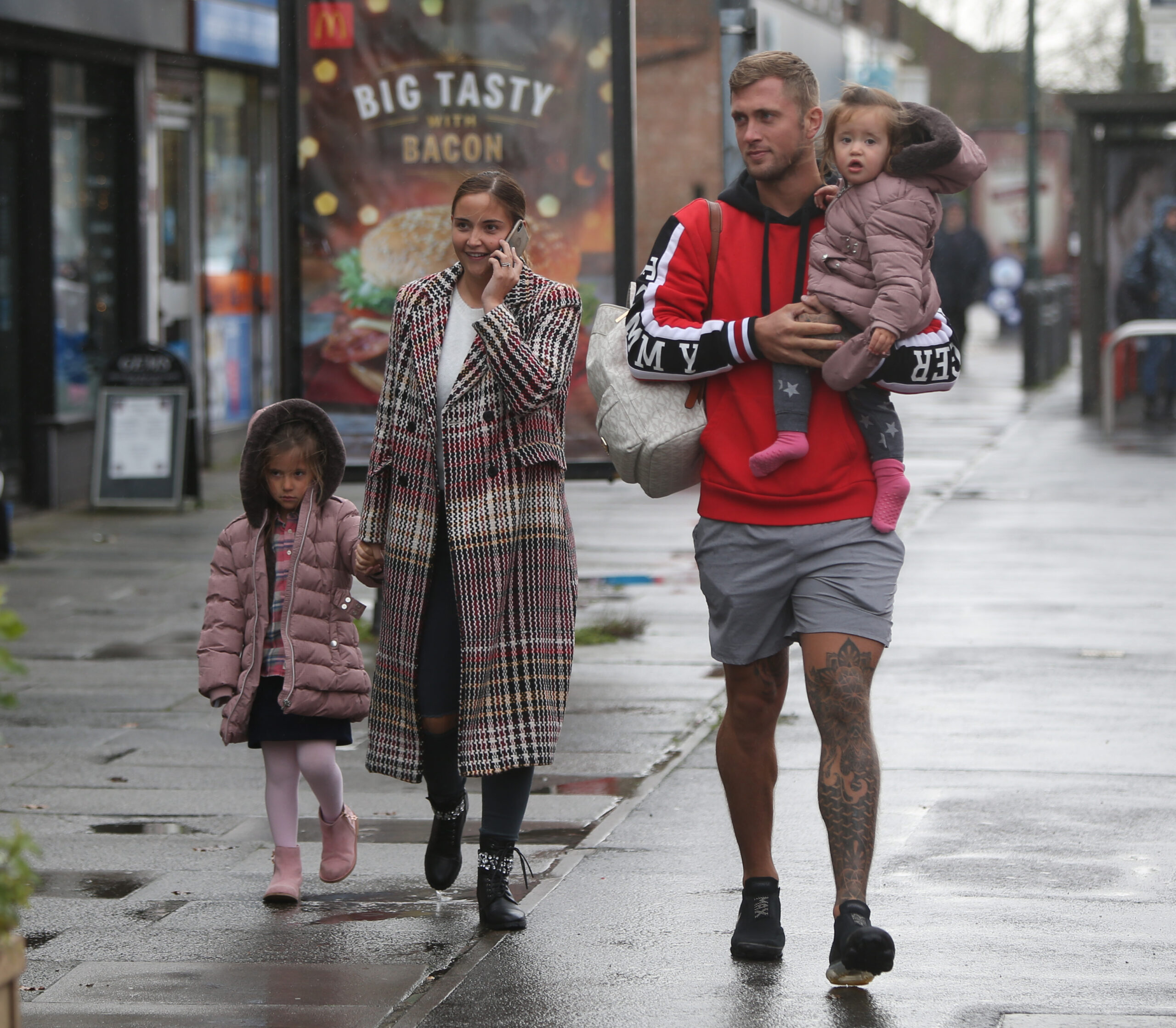 Dan Osborne and Jacqueline Jossa walking with their two daughters