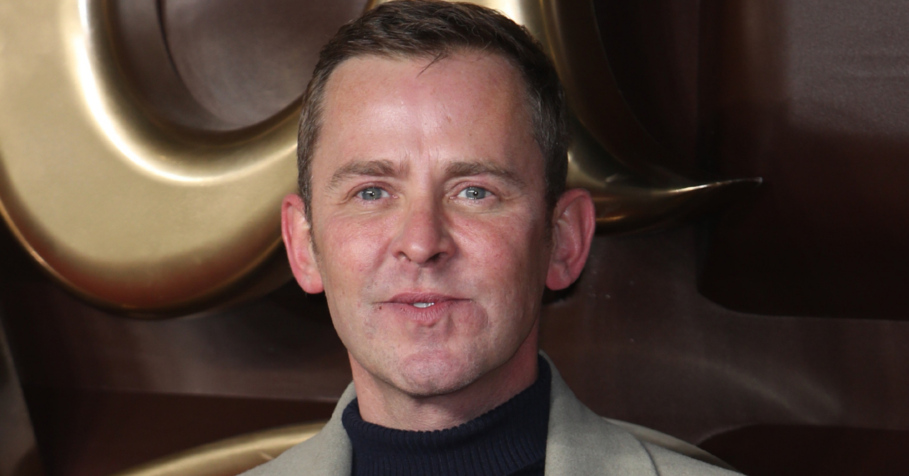 Scott Mills looking to camera