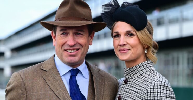 Peter Phillips smiling with Harriet Sperling at races